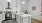 a kitchen with white cabinets