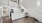 a kitchen with wooden-style flooring