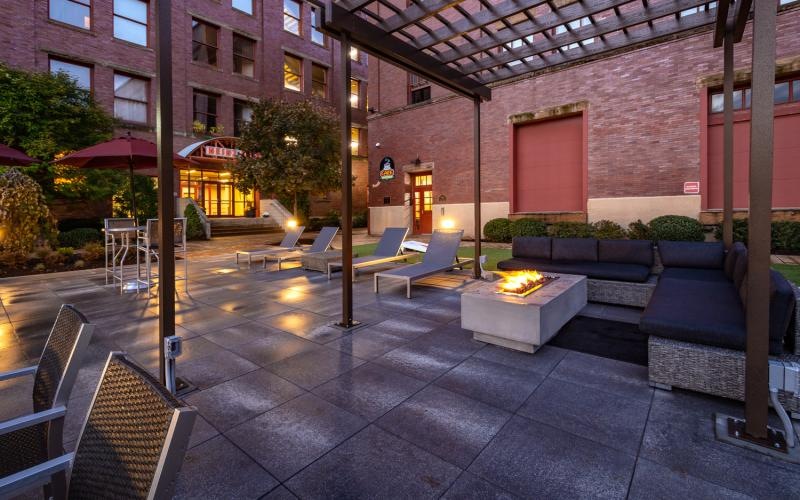 a courtyard with chairs and tables