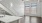 a white kitchen with a wood floor